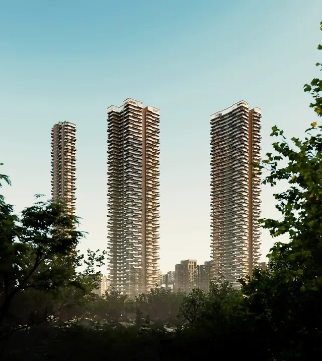 Ganga Anantam — tower elevation framed by trees
