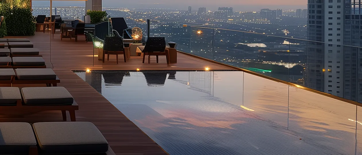 Rooftop infinity pool and sun deck overlooking the city at Ganga Anantam